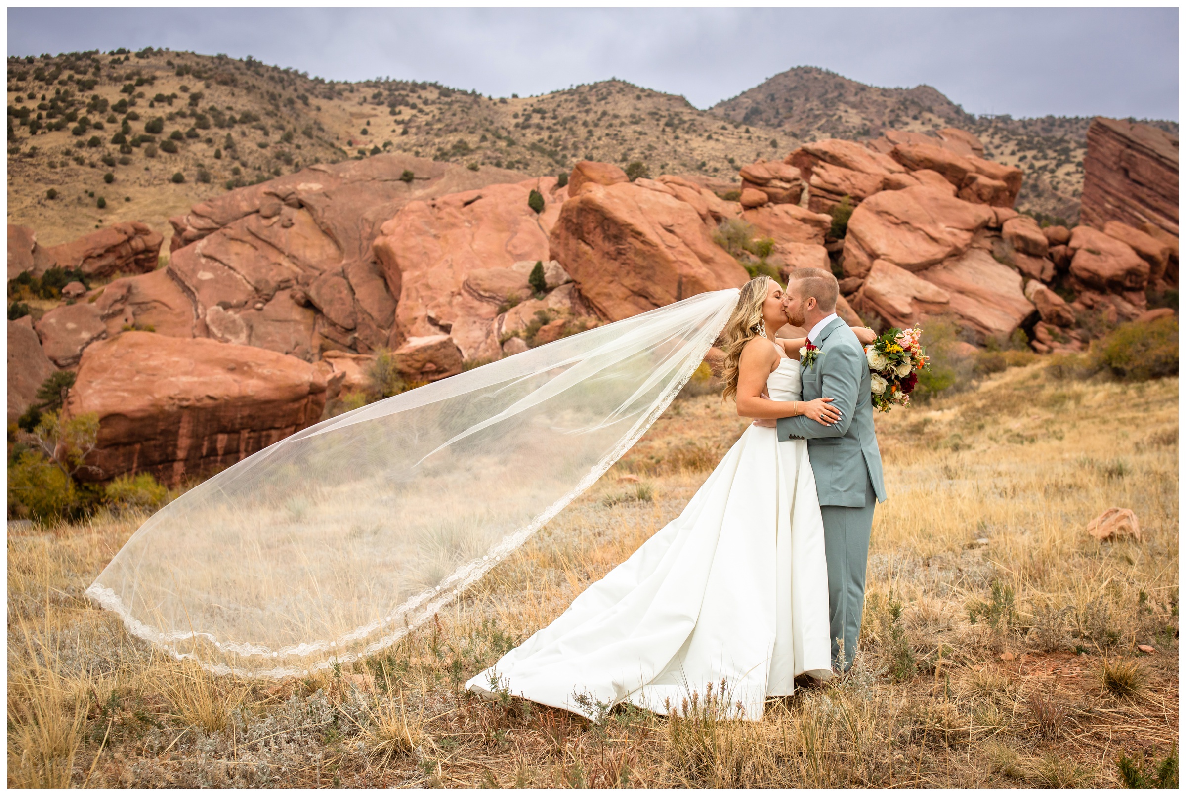 brides veil flying during Willow Ridge Manor Colorado wedding pictures by Plum Pretty Photography
