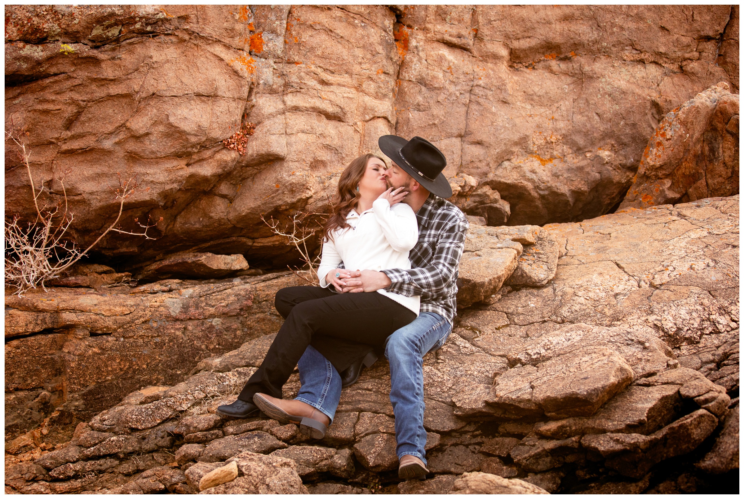 couple sitting on large rocks during Estes Park Colorado engagement photos by Plum Pretty Photography