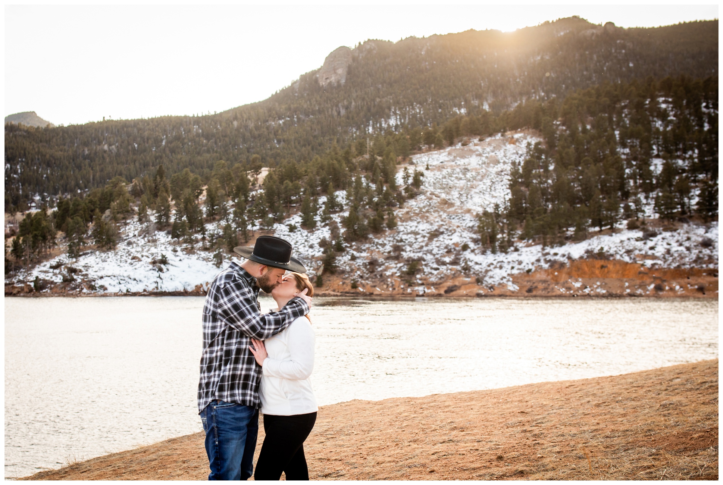 couple kissing next to Mary's Lake in the Colorado mountains