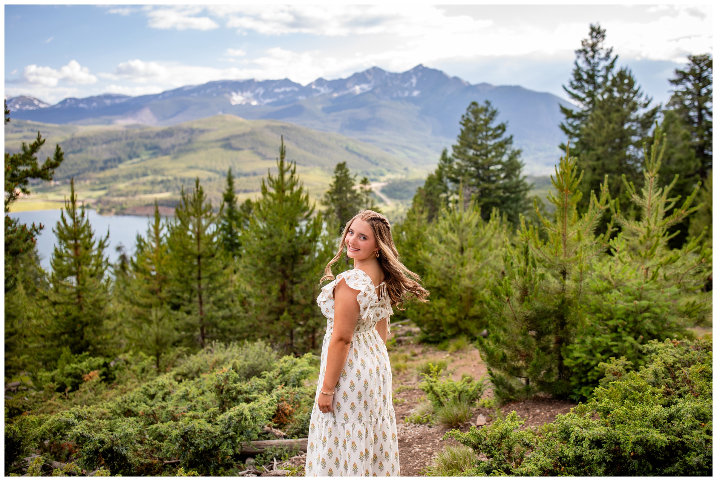 teen posing in front of mountain backdrop during Breckenridge CO senior pictures at Sapphire Point