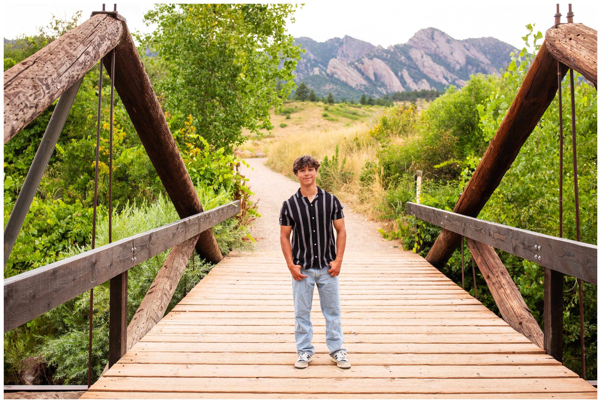teen posing on bridge at South Mesa Trail during Boulder Colorado senior portraits by Plum Pretty Photography 