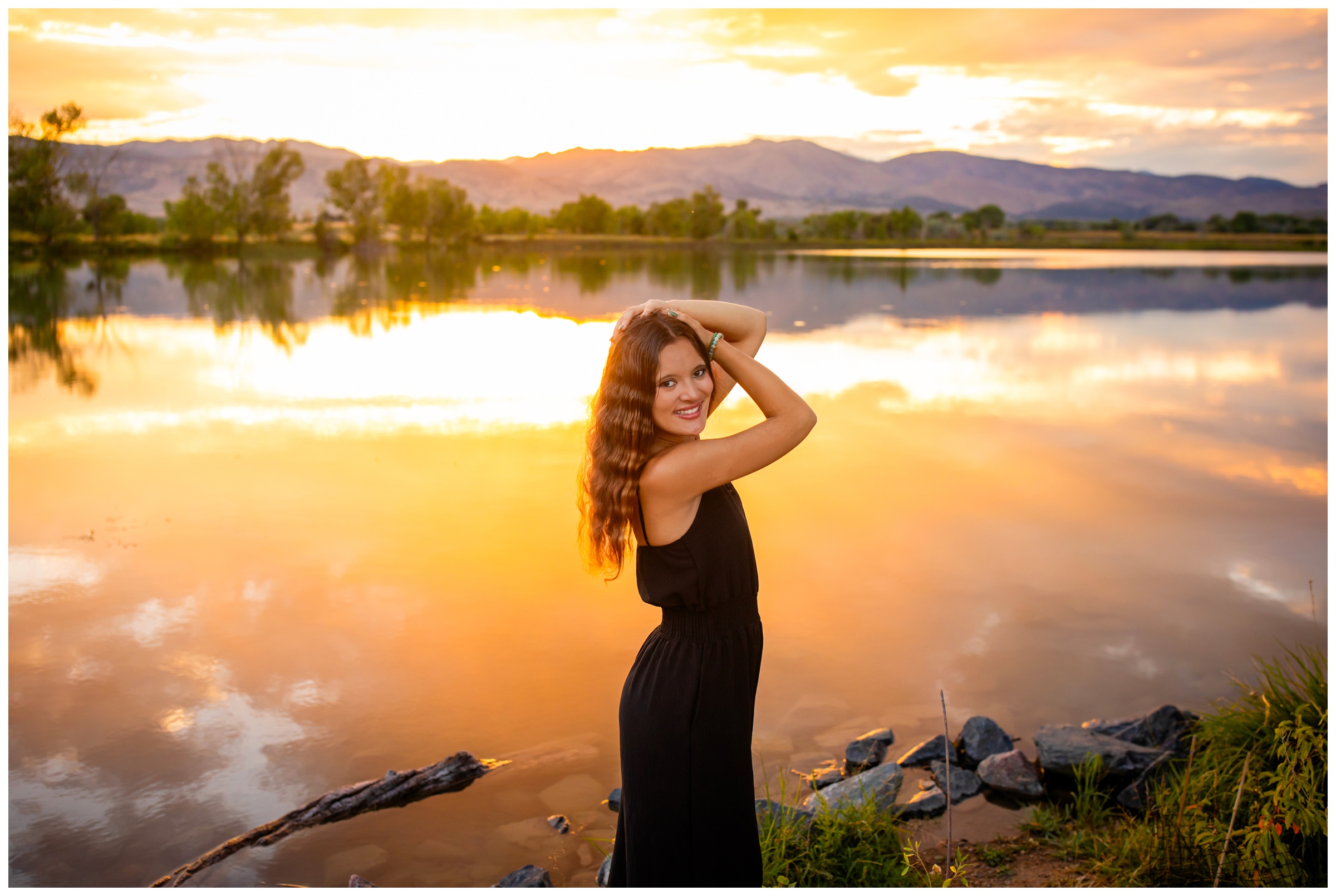 silver creek high school student posing in front of Coot Lake during sunset senior photos in Boulder