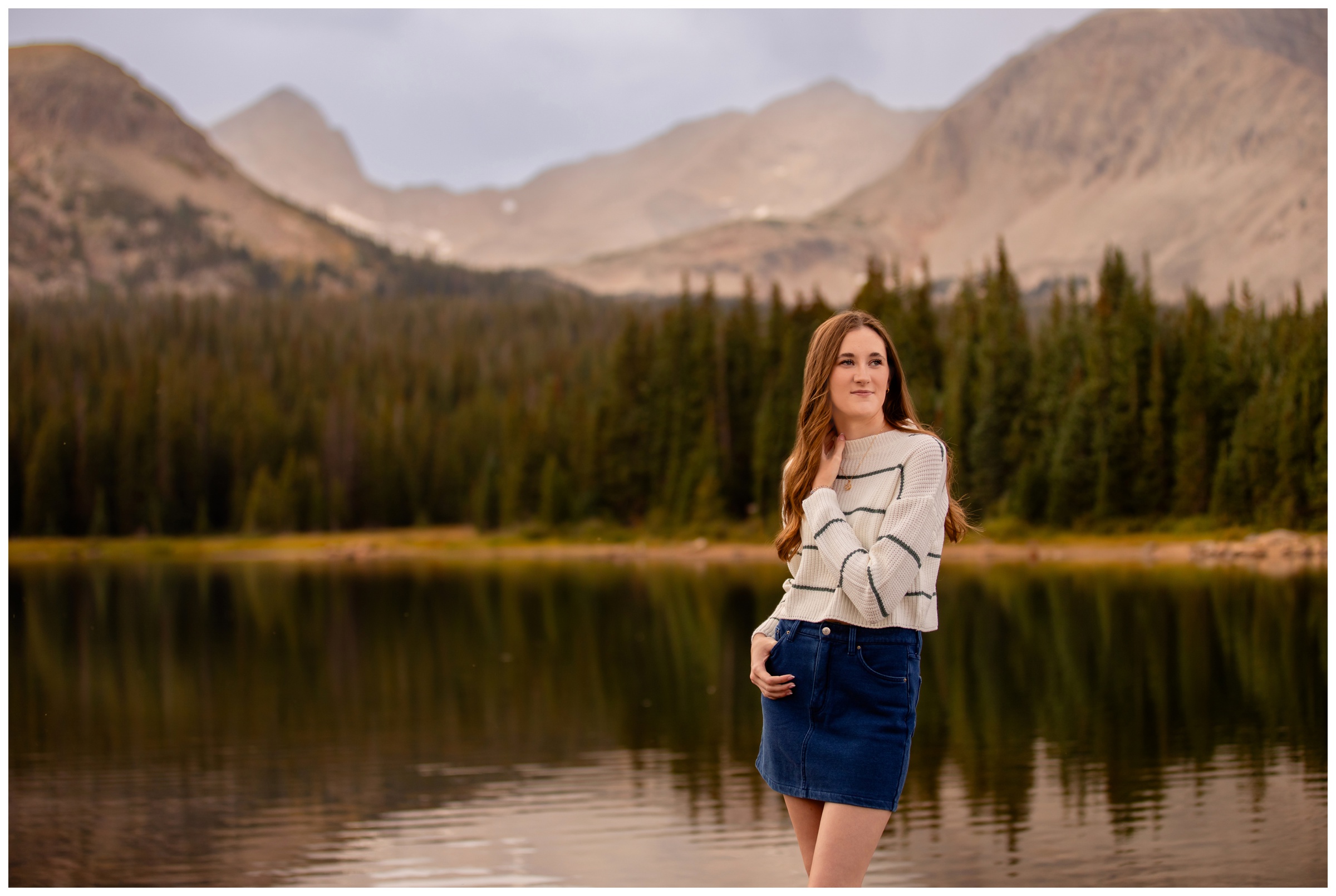 teen posing in front of Brainard Lake during Colorado high school photography session 