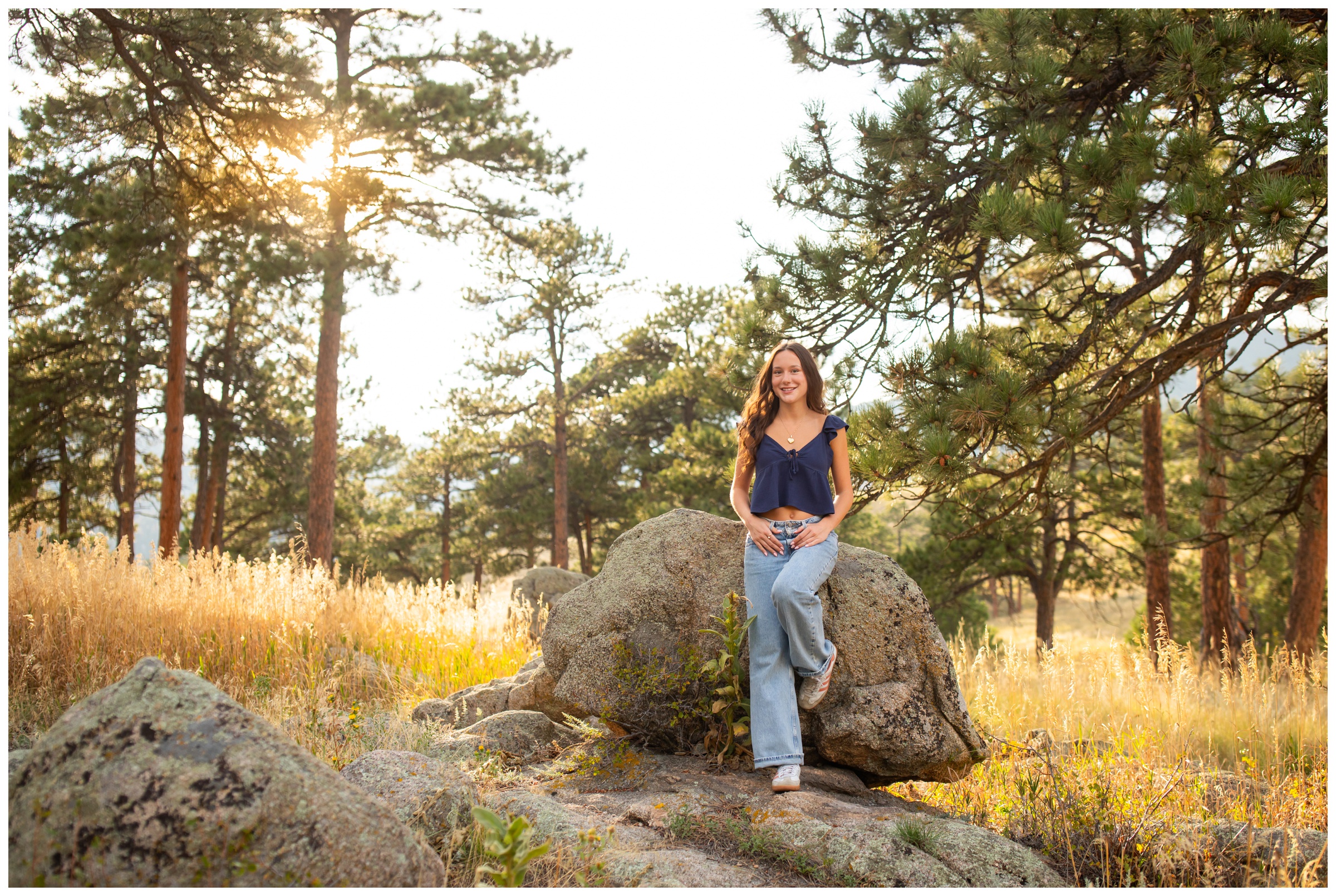 teen leaning against rock at Boulder graduation photography session at Betasso Preserve 
