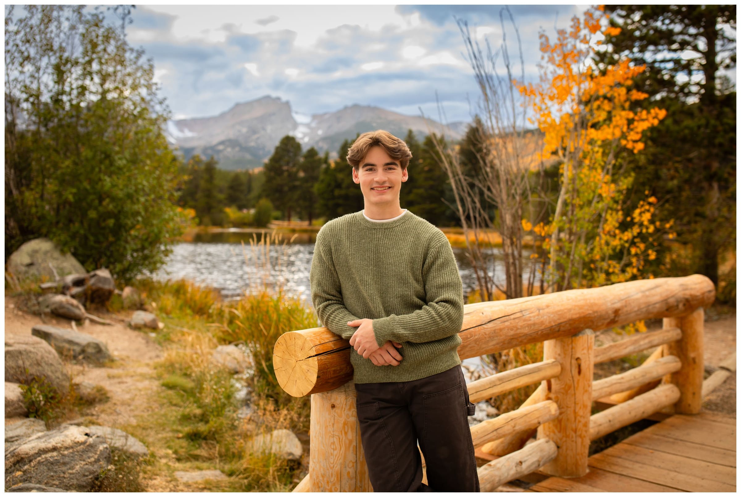 teen leaning on bridge at Sprague Lake during Colorado fall senior photos 