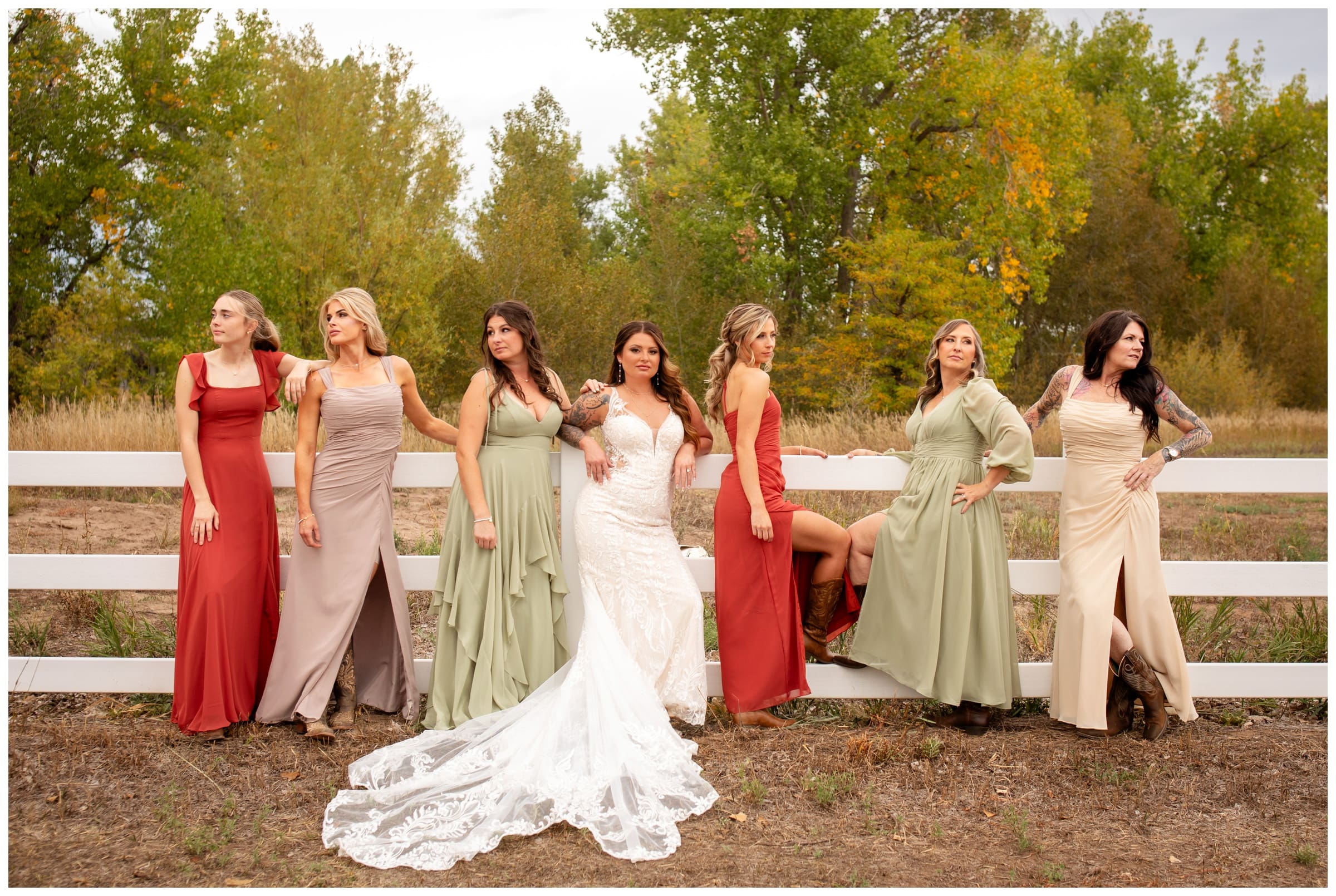 bridesmaids in fall colors during rustic country wedding in Longmont Colorado 