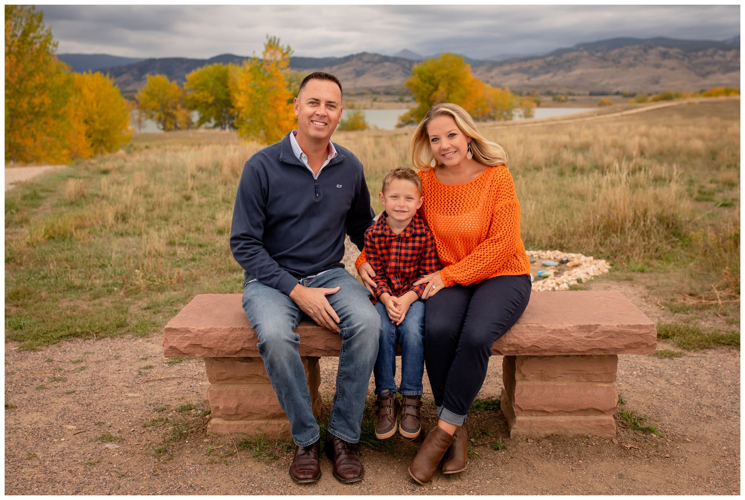 family sitting on bench at Coot Lake during fall family photography session by Plum Pretty Photography 