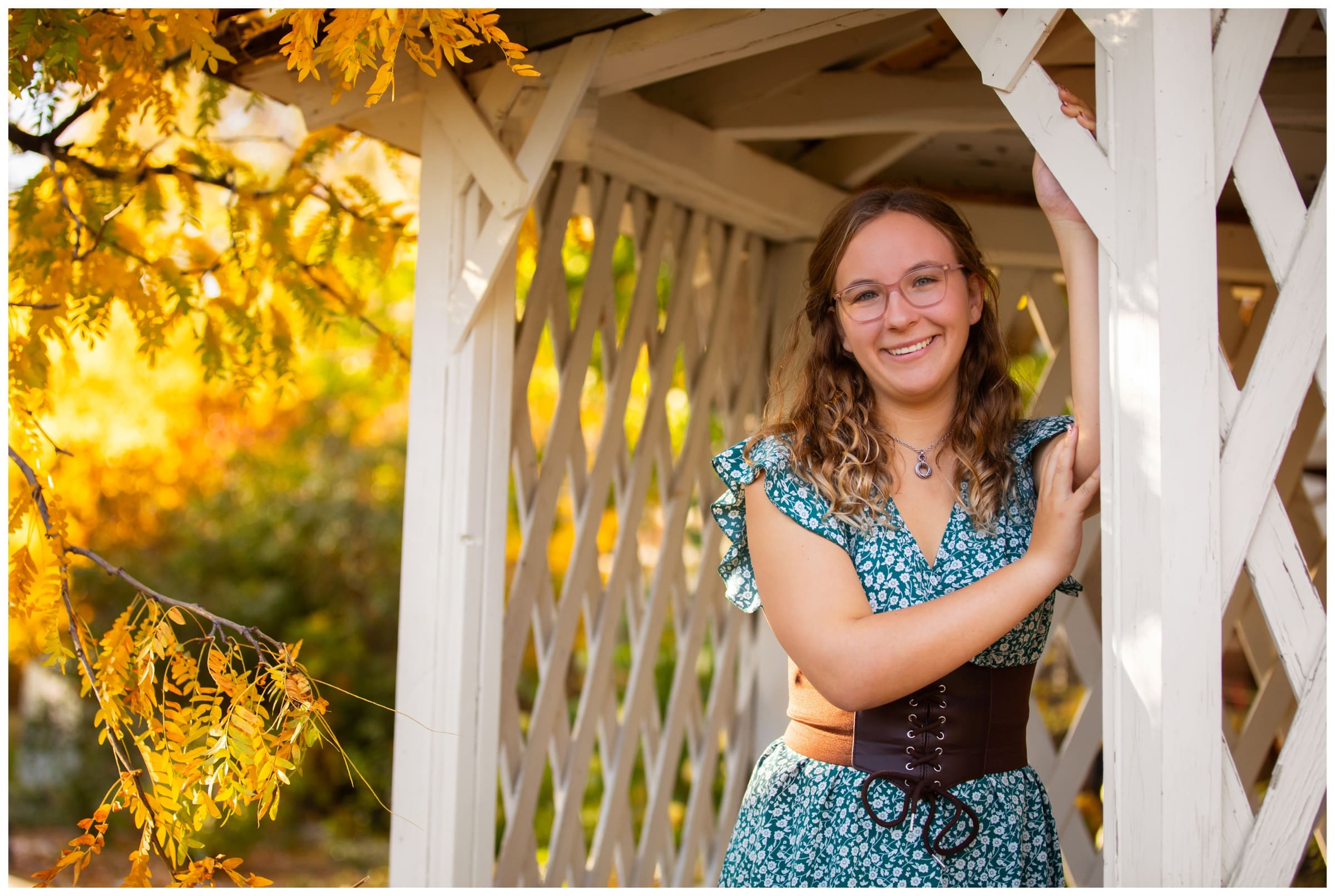 teen leaning against gazebo during Silver Creek Senior pictures in Longmont Colorado 