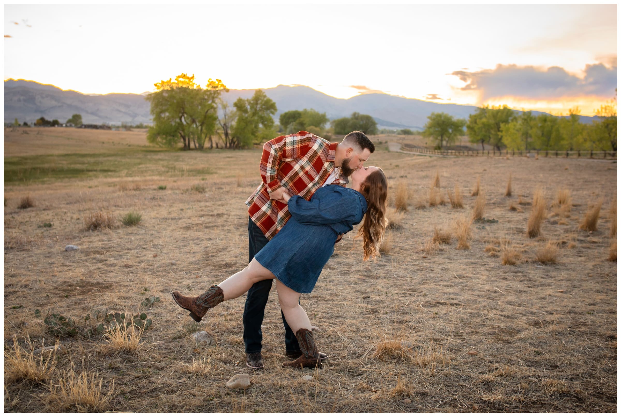 man dipping fiancee during mountain engagement session at Coot Lake Boulder